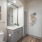 well lit bathroom with linen closet