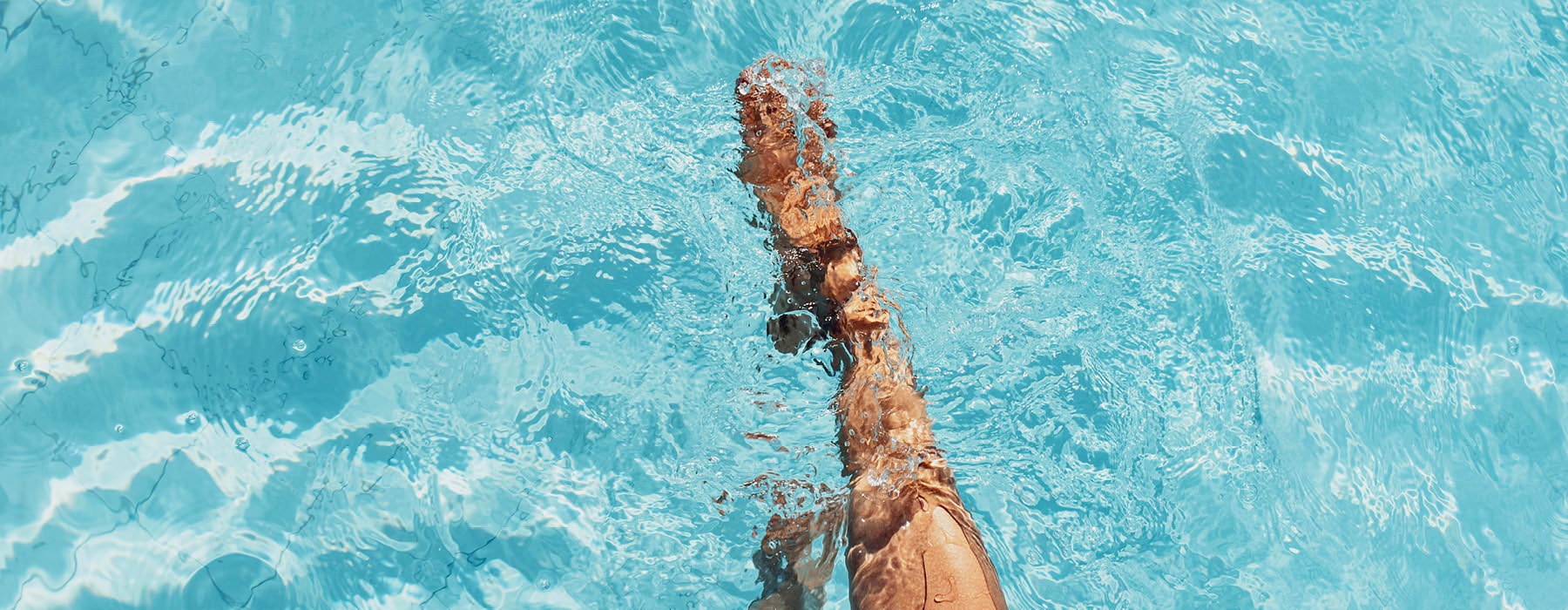legs in swimming pool