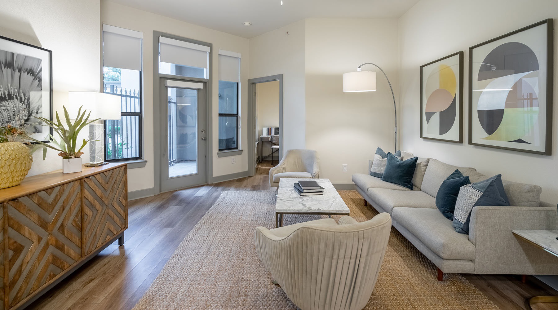 WELCOME TO SEVILLE UPTOWN spacious living room with access to private patio